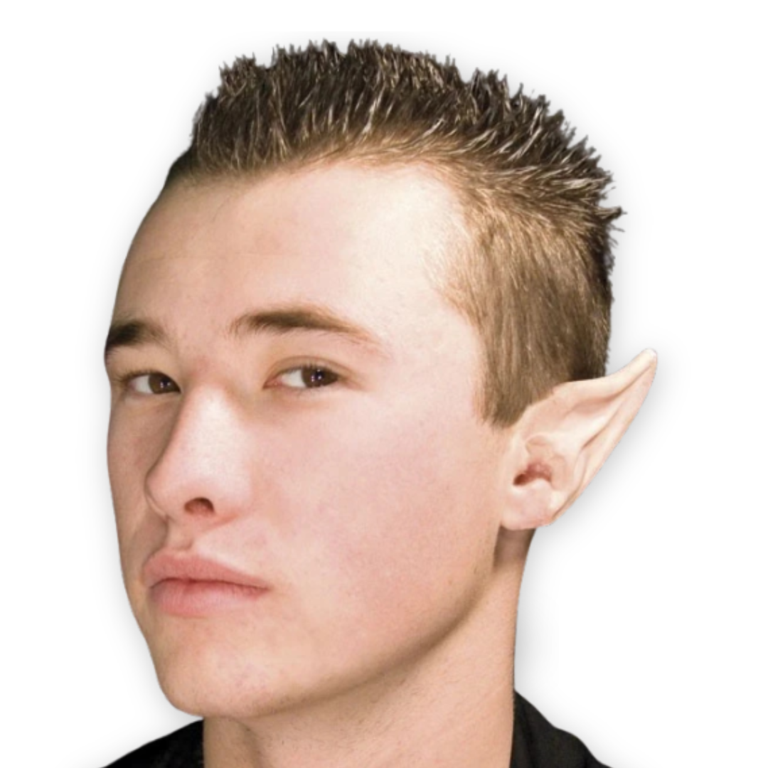 A close-up portrait of a young man with a pointed elf ear prosthetic attached to his ear, shown against a plain white background.