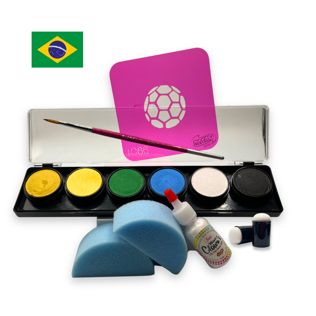 Brazil-themed soccer fan face paint kit featuring a 6-color water activated palette with green, yellow, blue, white, black, and metallic gold paints, a pink soccer stencil, professional round brush, two blue face painting sponges, a bottle of Mama Clown glitter, and foam daubers displayed on a white background.