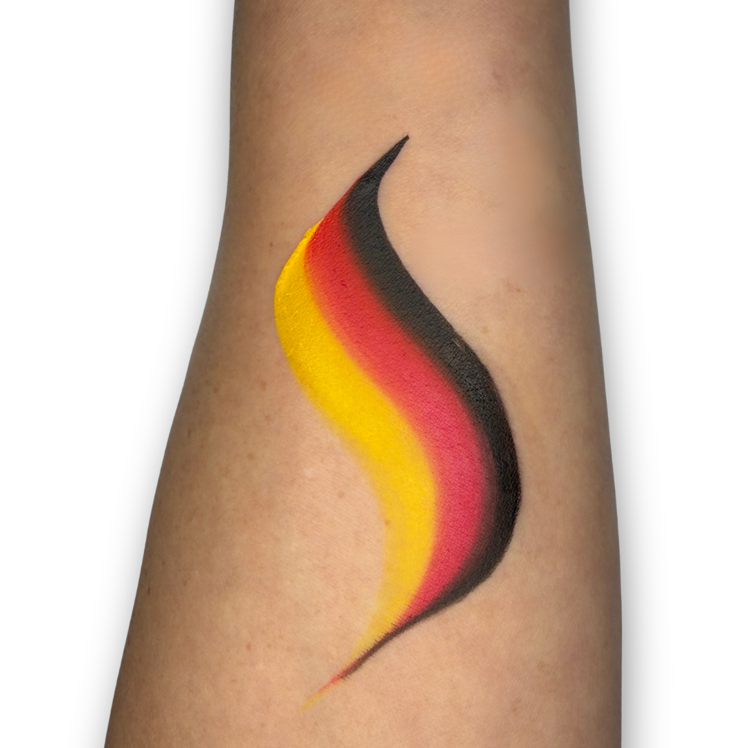 Black, red, and yellow one-stroke face paint swatch with bold blended stripes, inspired by Germany's national colors for world soccer fan face painting.