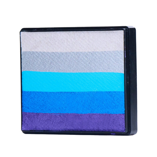 Image of a Rainbow Face Paint Cake featuring a palette of bright colors arranged in stripes. Designed for easy application, this face paint allows artists to create bold, blended, multi-color designs with a single swipe. Ideal for a variety of themes and festive occasions.