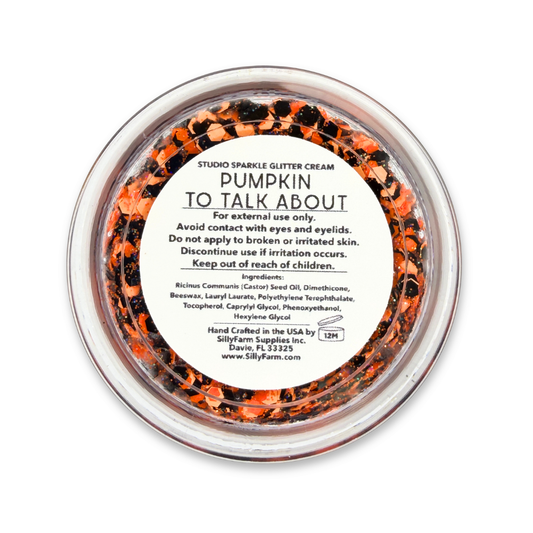 Close-up of Pumpkin to Talk About Glitter Cream with bright orange, black, and holographic glitter.