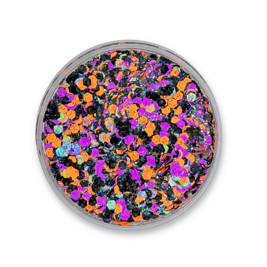 Close-up of Witchful Thinking Glitter Cream with orange, purple, black, and holographic glitter.