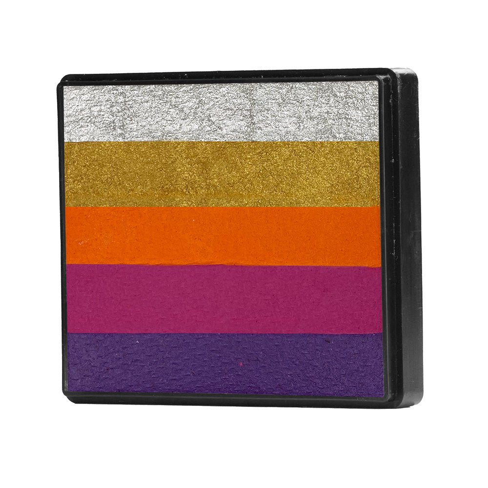 Image of a Rainbow Face Paint Cake featuring a palette of bright colors arranged in stripes. Designed for easy application, this face paint allows artists to create bold, blended, multi-color designs with a single swipe. Ideal for a variety of themes and festive occasions.