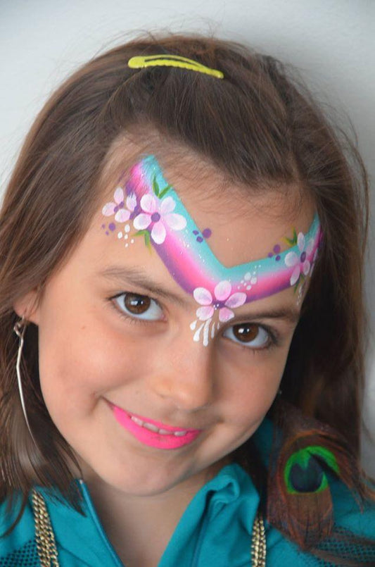 Face paint design using Arty Cakes, showing bold, multi-color effects in one stroke for dynamic face and body art.
