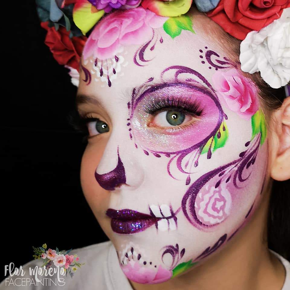 Face paint design using Arty Cakes, showing bold, multi-color effects in one stroke for dynamic face and body art.
