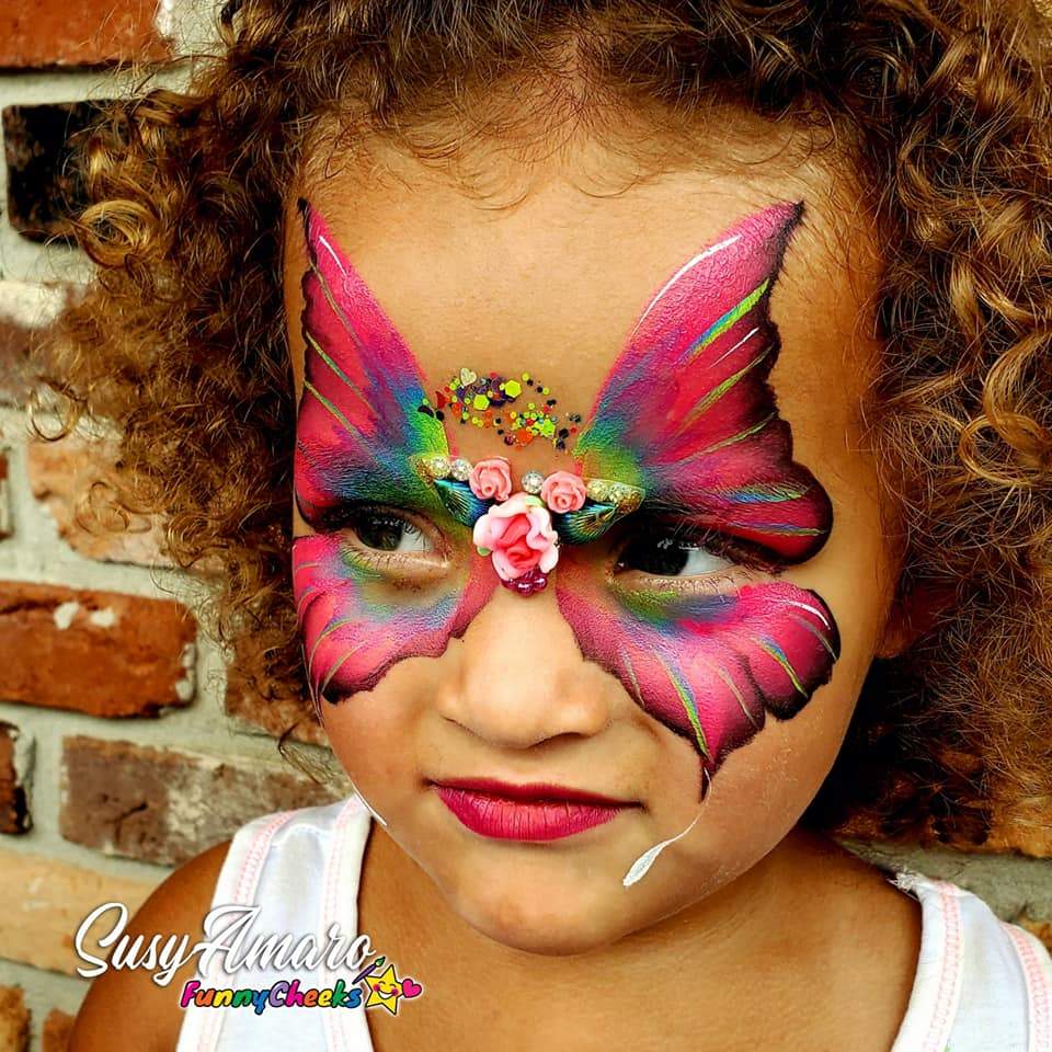 Face paint design using Arty Cakes, showing bold, multi-color effects in one stroke for dynamic face and body art
