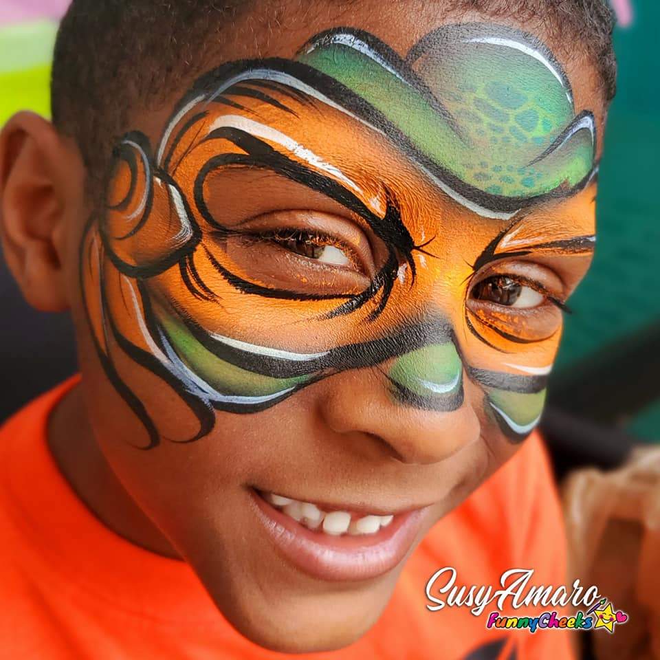 Face paint design using Arty Cakes, showing bold, multi-color effects in one stroke for dynamic face and body art
