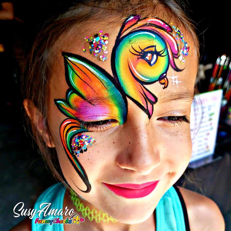 Face paint design using Arty Cakes, showing bold, multi-color effects in one stroke for dynamic face and body art